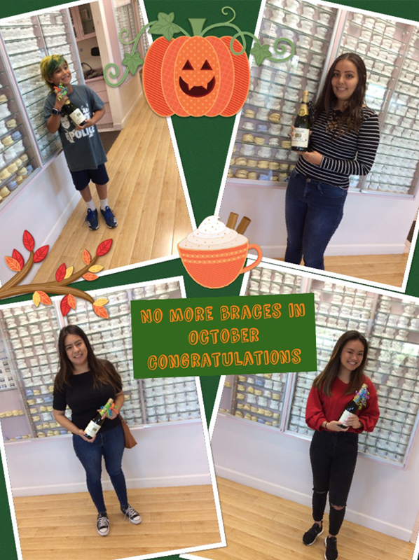 Team members celebrate Halloween at Brenn Orthodontics office with pumpkin decorations and costumes.