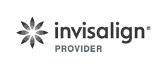 Invisalign Provider logo, gray starburst symbol with text indicating orthodontic treatment affiliation.